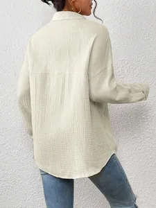 Back view of beige oversized textured long sleeve shirt with drop shoulder design