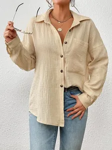 Detailed view of apricot crinkle cotton long sleeve button-down shirt with front pocket