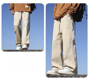 Close-up of men's loose straight cotton wide-leg casual pants in beige outdoor