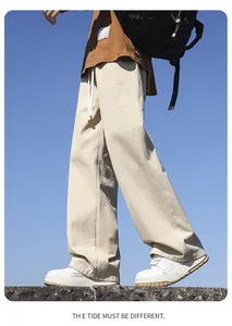 Model wearing beige wide-leg cotton casual pants against a clear blue sky background.