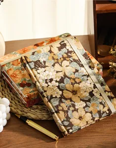 Vintage A5 corduroy notebook detail featuring retro floral fabric and elastic strap.
