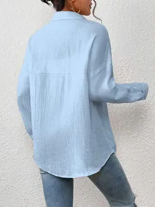 Detailed back view of light blue women's drop shoulder long sleeve shirt in crinkle fabric