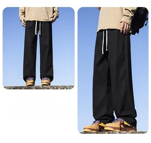 Side and front view of men's loose black straight-leg casual cotton pants