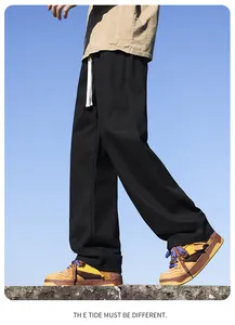 Detail view of men's black loose straight-leg cotton casual pants for daily street style