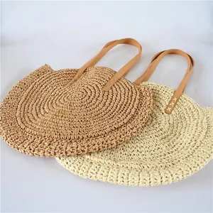 Round woven straw shoulder beach bag for women in brown and beige