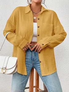 Casual yellow long-sleeved shirt with drop shoulder and button-down style
