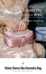 Velvet starry sky cosmetic bag held by a model in a floral dress