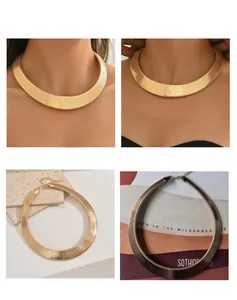 Detail showing bold gold snake bone choker necklace with textured finish on model.