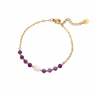 Detail view of gold-plated stainless steel bracelet with amethyst beads and a pearl