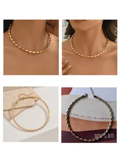 Detail view of minimalist twisted wave snake bone choker necklace in gold and silver finish.