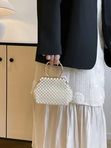 Handmade pearl-beaded handbag for women with gold ring handle and elegant chain strap