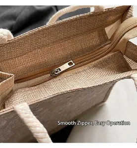 Close-up view showing the smooth metal zipper closure on a stylish natural jute tote bag