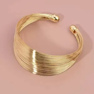 Elegant multi-strand open cuff bracelet in gold finish with a wide band design style