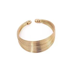 Elegant gold multi-strand open cuff bracelet for women, chic statement fashion jewelry.