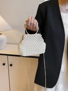 Elegant handmade white pearl beaded handbag with gold ring handle and chain strap