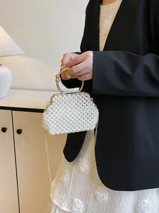 Elegant handmade woven pearl handbag for women, vintage style for bride and bridesmaid.