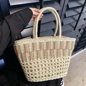 Detailed view of handmade straw woven tote bag with durable handles