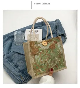 Detailed view of the green floral jacquard pattern on a women's tote bag