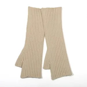 Knitted long fingerless arm warmers in beige with ribbed texture for winter