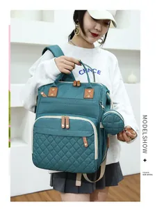 Detailed view of teal stylish large capacity mummy diaper backpack with quilted design