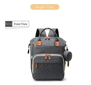 Detailed front view of a dark grey quilted diaper backpack featuring tan leather accents.