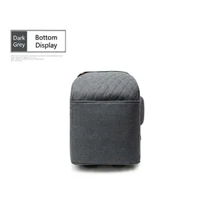 Bottom view detail of a grey quilted diaper bag with durable fabric.