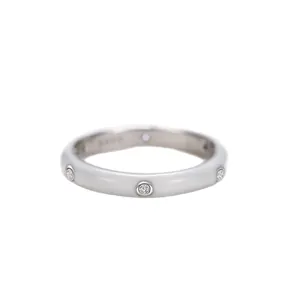 Minimalist silver ring with white enamel and sparkling zircon stones in a sleek design.