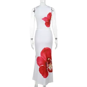 Back view detail of white vacation set showing large red floral print on long skirt