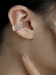 Detail of sparkling marquise zircon wheat ear cuff shown on model's ear, non-pierced.