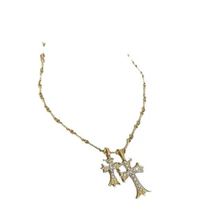 Gold plated gothic double cross pendant necklace featuring sparkling white stone inlays