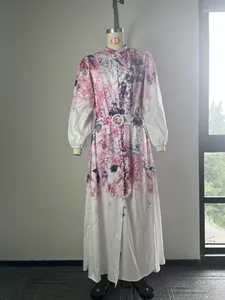 Detailed view of long-sleeved floral print maxi shirt dress with waist belt