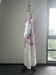 Side profile view of elegant floral print long sleeve maxi shirt dress on mannequin