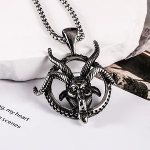 Detailed macro shot of vintage stainless steel Baphomet goat head pendant necklace