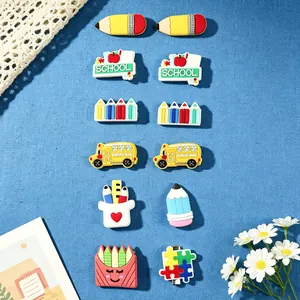 Set of 12 cute cartoon stationery hair clips for girls including pencils and bus