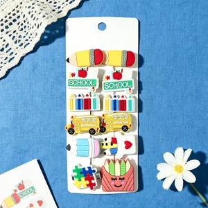 Detail view of 12pcs school-themed cartoon hair clips on display card