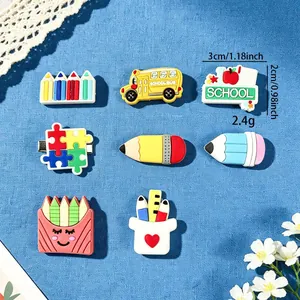Detailed view of cute cartoon stationery hair clips for girls on blue background.