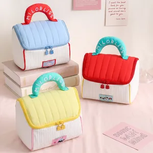 Quilted house-shaped cosmetic storage bag with colorful top handles for travel