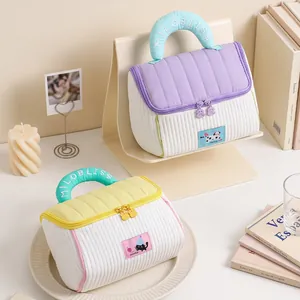 Stylish quilted house-shaped cosmetic storage bag with padded handle for travel and home