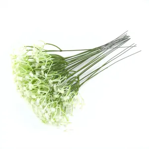 Close-up detail of artificial white baby's breath flowers with multiple green stems