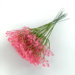 Detailed look at a bunch of artificial pink baby's breath flowers for wedding decor.