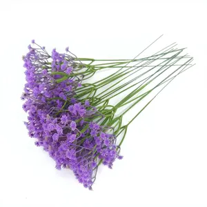 Detailed view of artificial purple Gypsophila baby's breath flowers for wedding decor.