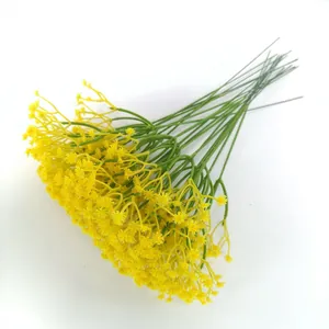 Detailed macro view showing the texture of vibrant yellow artificial baby's breath flowers