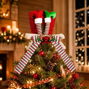 Red sequined Christmas tree topper hat with elf legs and festive striped bow details