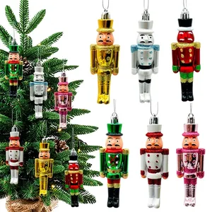 Detailed view of colorful nutcracker Christmas ornaments hanging on a festive tree.