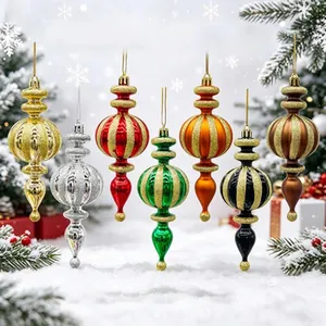 Assorted colorful painted plastic Christmas ornaments with glittery teardrop designs