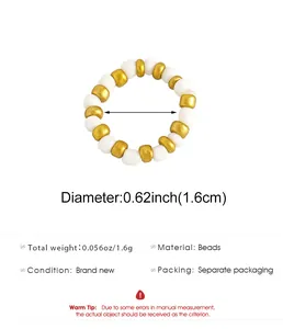 Detailed specification view showing diameter and weight of gold and white beaded ring.