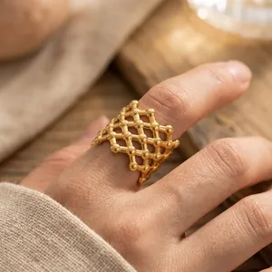 Elegant retro mesh open ring in 18K gold plated stainless steel worn on a finger