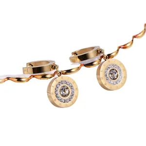 Elegant 18k gold titanium steel hoop earrings with Roman numeral crystal charms