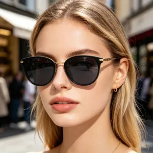 Close-up view of chic retro polarized sunglasses with black frames and gold temples.