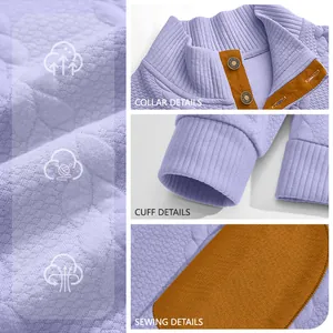 Close-up of purple jacquard sweatshirt showing collar, cuff, and stitching details